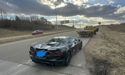 Chevrolet Corvette C8 stopped on roadside near tow truck