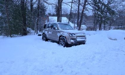 A 2026 Land Rover Defender 110 sits in a pile of snow