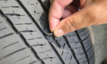 An original equipment tire is shown falling apart after just 12,000 miles