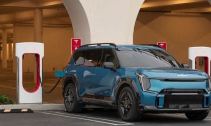 Image shows Kia EV9 at Tesla Supercharger