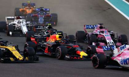 Image showing numerous F1 cars piling into a corner.