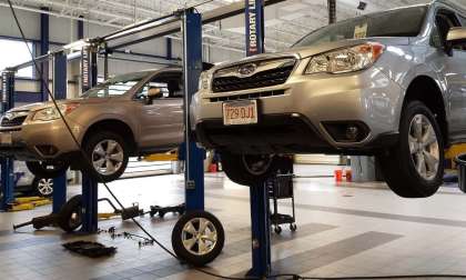 Image of Subaru Foresters being serviced by John Goreham