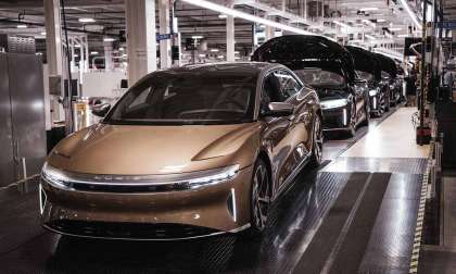 A gold Lucid Air Dream Edition is pictured rolling off the production line in Arizona.