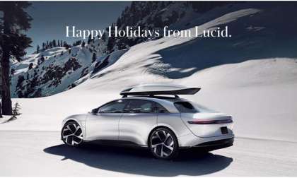 Image showing a silver Lucid Air with a new roof storage box against a snowy backdrop with the text "Happy Holidays from Lucid'