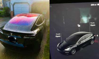 Black Tesla Model 3 with multimedia display showing maximum driving range