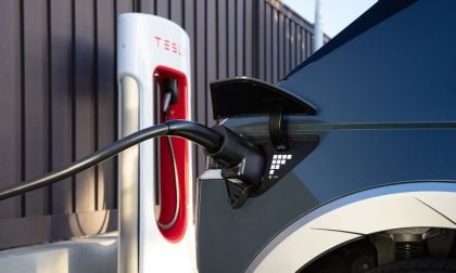 Image shows a Hyundai Ioniq 5 charging at a Tesla Supercharger