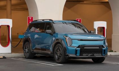 Image of a 2025 Kia EV charging up at a Tesla Supercharger courtesy of Kia media support. 