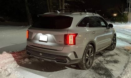Silver Kia Sorento PHEV at night in the snow