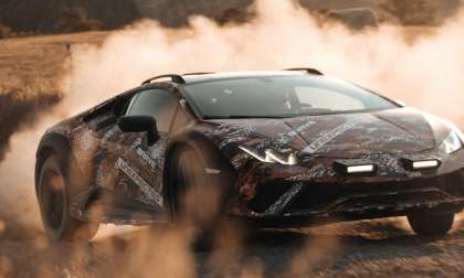 Image showing a Lamborghini Huracan Sterrato kicking up a huge cloud of dust while sliding sideways on a gravel road.