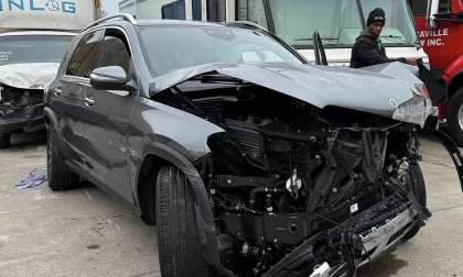 Laura’s Mercedes GLE 450e displayed after sustaining extensive front-end damage in a collision that activated multiple airbags.