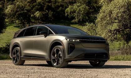 Lucid Gravity luxury electric SUV parked outdoors highlighting front design and LED lighting signature