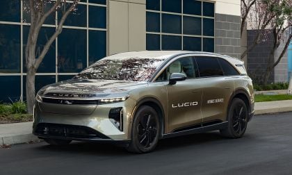 Lucid Gravity electric SUV mobile service vehicle parked outside a modern building