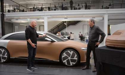 Image showing Lucid Design VP Derek Jenkins with a full-scale clay model version of the Lucid Air.