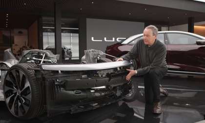 Image showing Lucid CEO Peter Rawlinson with a front end module from a Lucid Air.