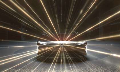 Image showing the front of a Lucid Air with beams emanating from its central Lidar unit.