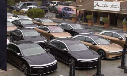 Image shows multiple Lucid Air sedans parked together at the end of the Lucid Rally.