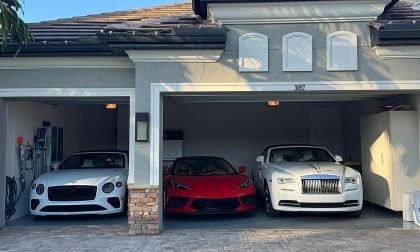 Luxury garage showing Bentley, Chevrolet Corvette, and Rolls Royce parked inside