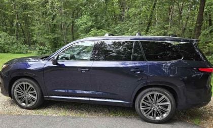 2025 Lexus TX 350 AWD in blue with a forest background