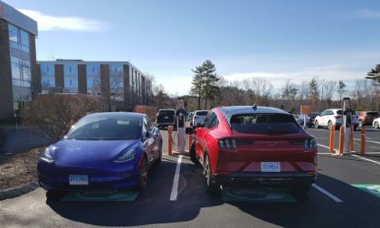 Image shows two EVs charging in Mass.