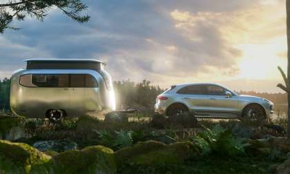 Image showing a Porsche Macan and Porsche-Airstream Concept Travel Trailer, both in silver shining in the evening sun.