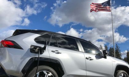 Image of Toyota RAV4 Prime and American flag by Kate Silbaugh