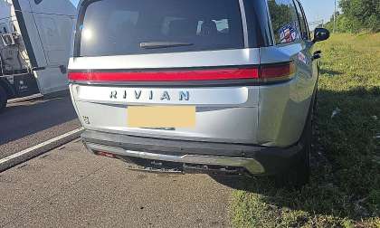 Rear view of Mike's Rivian R1S showing minor bumper damage after being struck from behind on the highway.