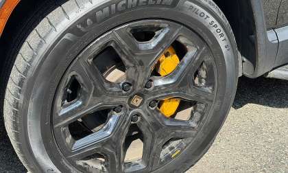 Close-up of a Rivian R1T wheel with Michelin Pilot Sport S5 tire and yellow brake caliper.