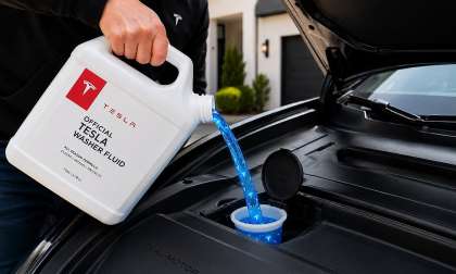 An image shows magic Tesla washer fluid being added to a Model Y's reservoir