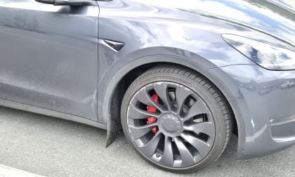 Tesla Model Y with curb rash all over its wheels from FSD hitting curb when parking