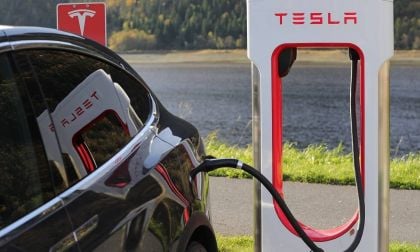 Tesla bearish outlook spreads the markets as Black Tesla Model S is charging at a supercharger