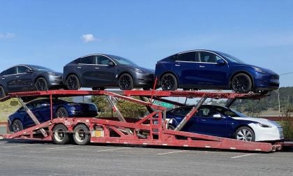 Tesla car deliveries on a truck.