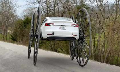 Driving a Tesla Upside Down With 10 Feet Tall Wheels