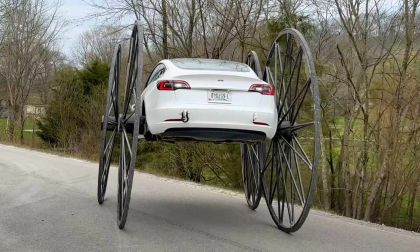 Driving a Tesla Upside Down With 10 Feet Tall Wheels
