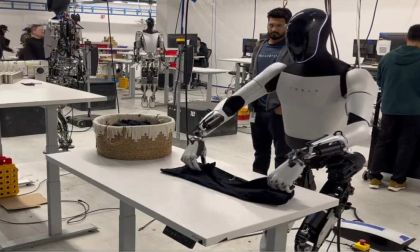 "Optimus Folds a Shirt" - Tesla Humanoid Robot Seen Folding Shirt In Factory Demonstration