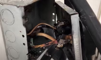 Image shows an electrical fire inside an EV charger junction box