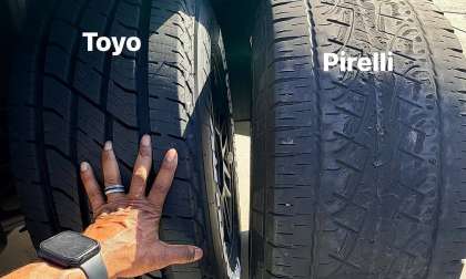 Close-up comparison of Toyo and Pirelli tire tread wear with labels on each tire.