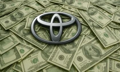 An AI generated image showing Toyota's logo on a pile of U.S. dollars