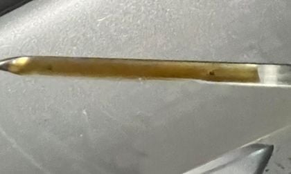 A Toyota RAV4 dispstick shows extra oil after an oil change service