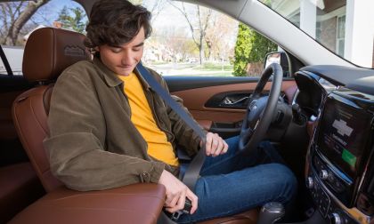 Teen driving a Chevy car