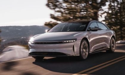Image showing a white Lucid Air Grand Touring driving on a mountainside road.