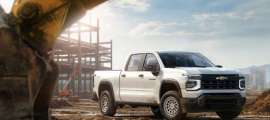 2027 Chevrolet Silverado 1500 Work Truck in Summit White. Exterior passenger front 34 beauty shot.