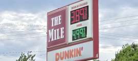 A gasoline station sign in Greenville, NH shows gas at well under $4/gallon
