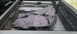 A Ford Maverick Lobo is shown with a soft cargo bag in the bed.