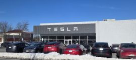 A Tesla dealership in Massachusetts is stocked with cars in a winter setting