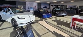 A Tesla dealership in Peabody Massachusetts has many cars on the showroom floor