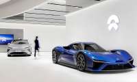 Modern NIO showroom featuring two sleek cars.