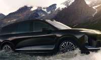 Nio ES8 driving through a mountain stream