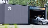 Grey NIO car inside a battery swap station