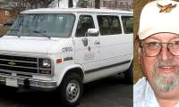 1990s Chevy work van, parked, showing some age and Richard Coyle