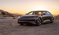2022 Lucid Air electric luxury sedan shown from front three-quarter angle in desert landscape at sunset